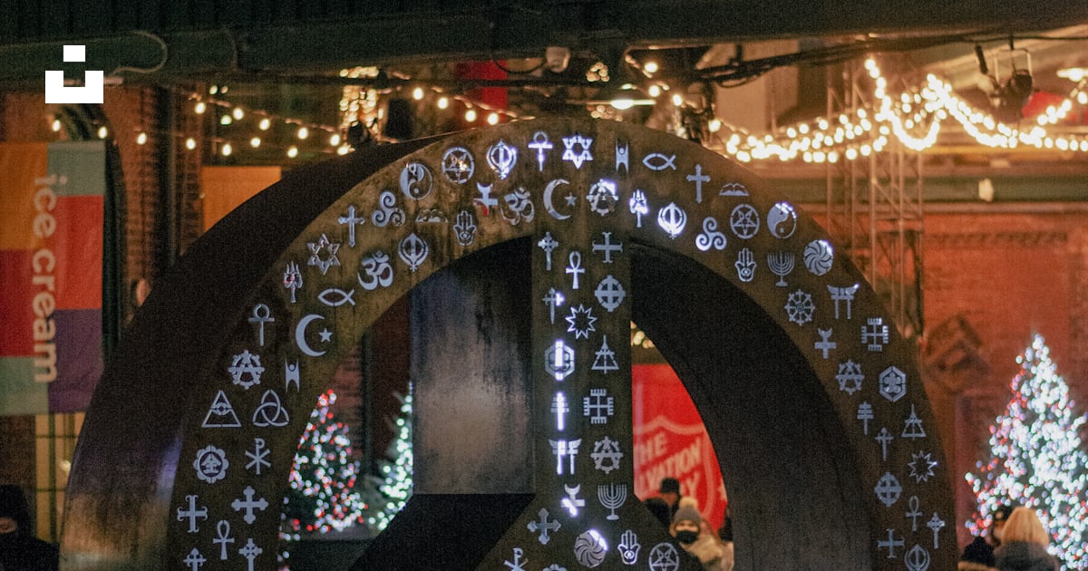 A peace sign on a city street at night photo – Free Distillery district ...