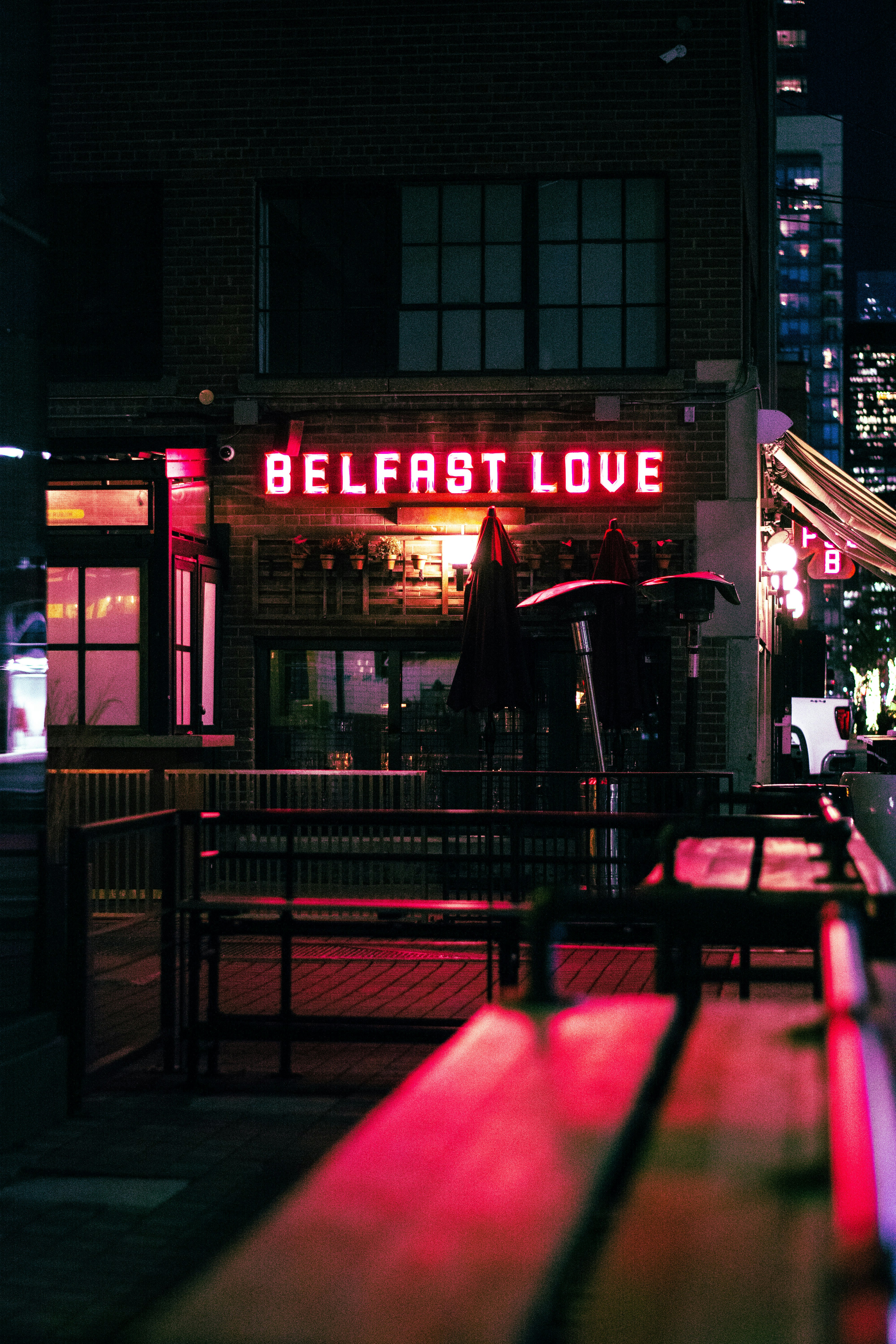 a restaurant at night with a neon sign