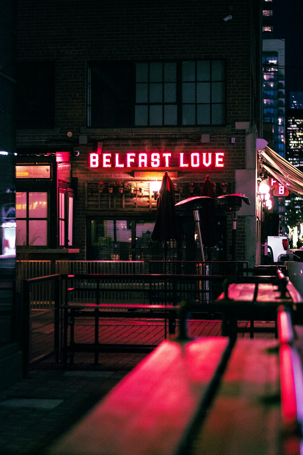 a restaurant at night with a neon sign