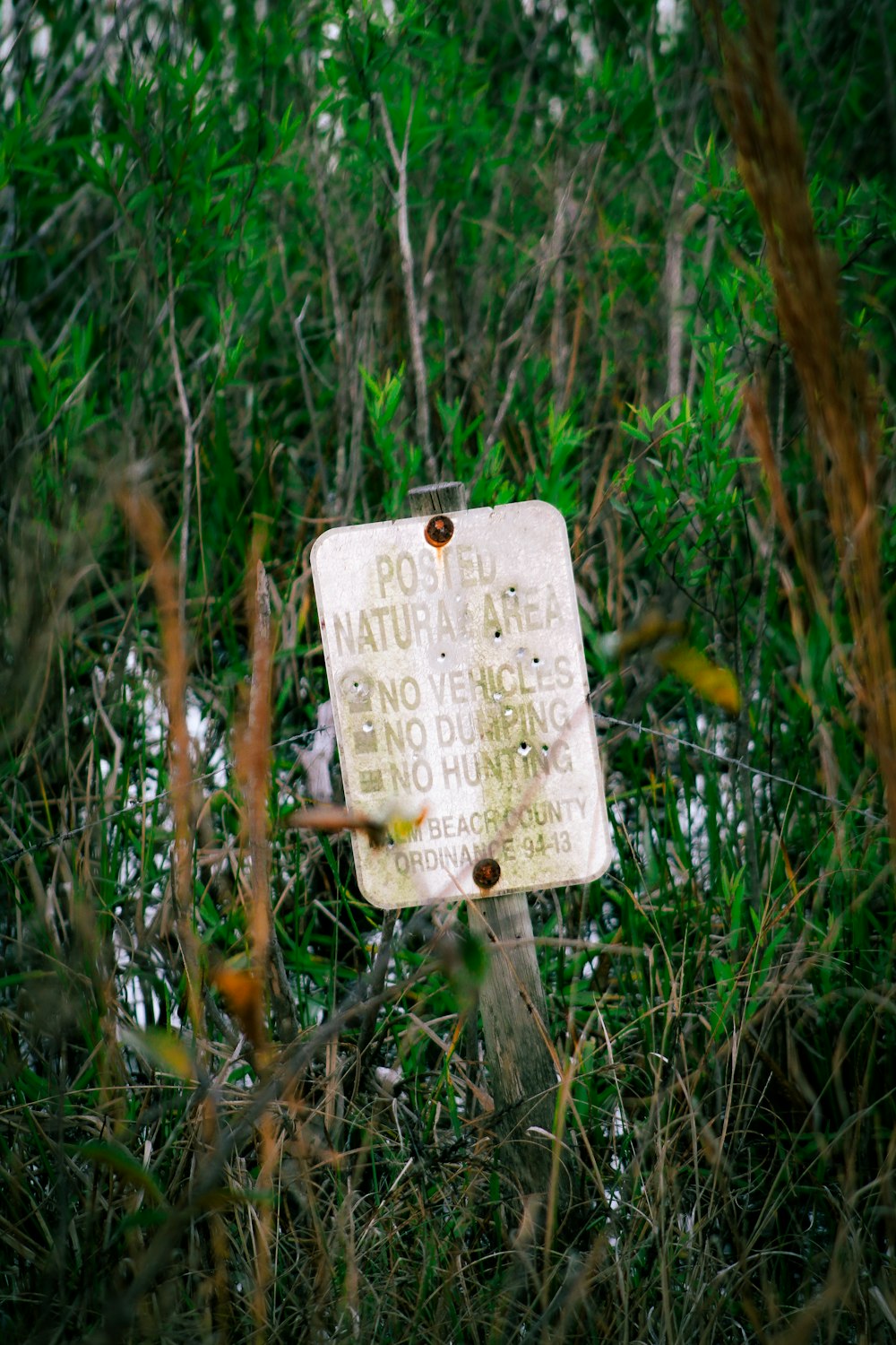 a sign that is in the middle of some grass