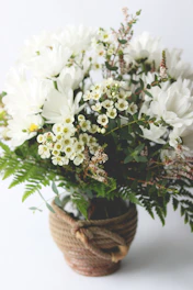 Bright colorful bouquets of fresh flowers arranged in rustic baskets