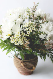 Bright colorful bouquets of fresh flowers arranged in rustic baskets