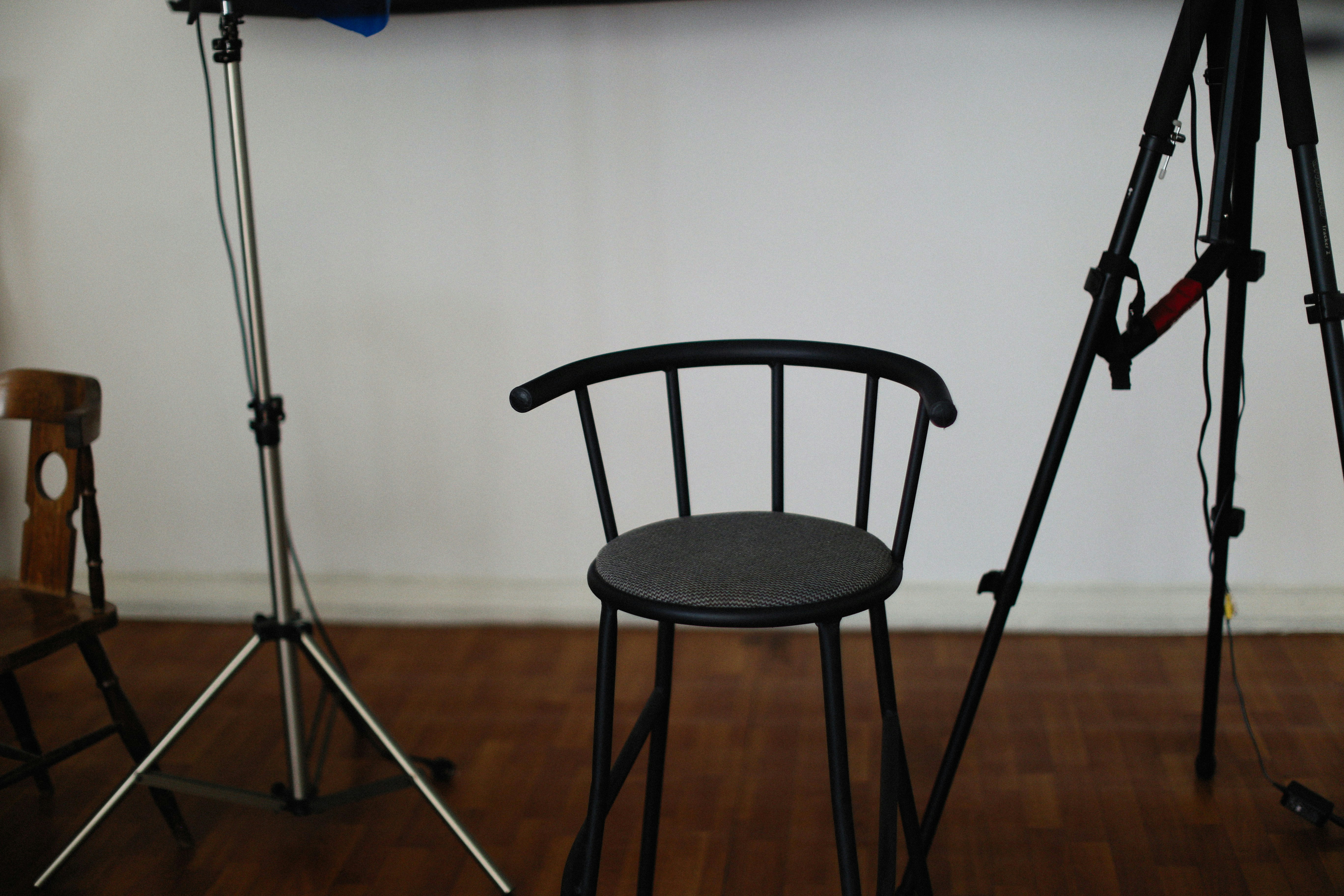 a chair and a tripod in a room