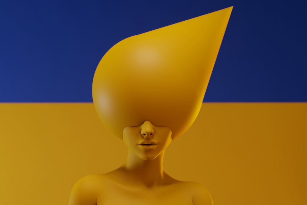 a yellow sculpture with a blue and yellow background