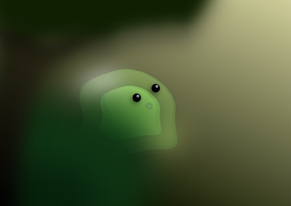 a blurry image of a green object with eyes