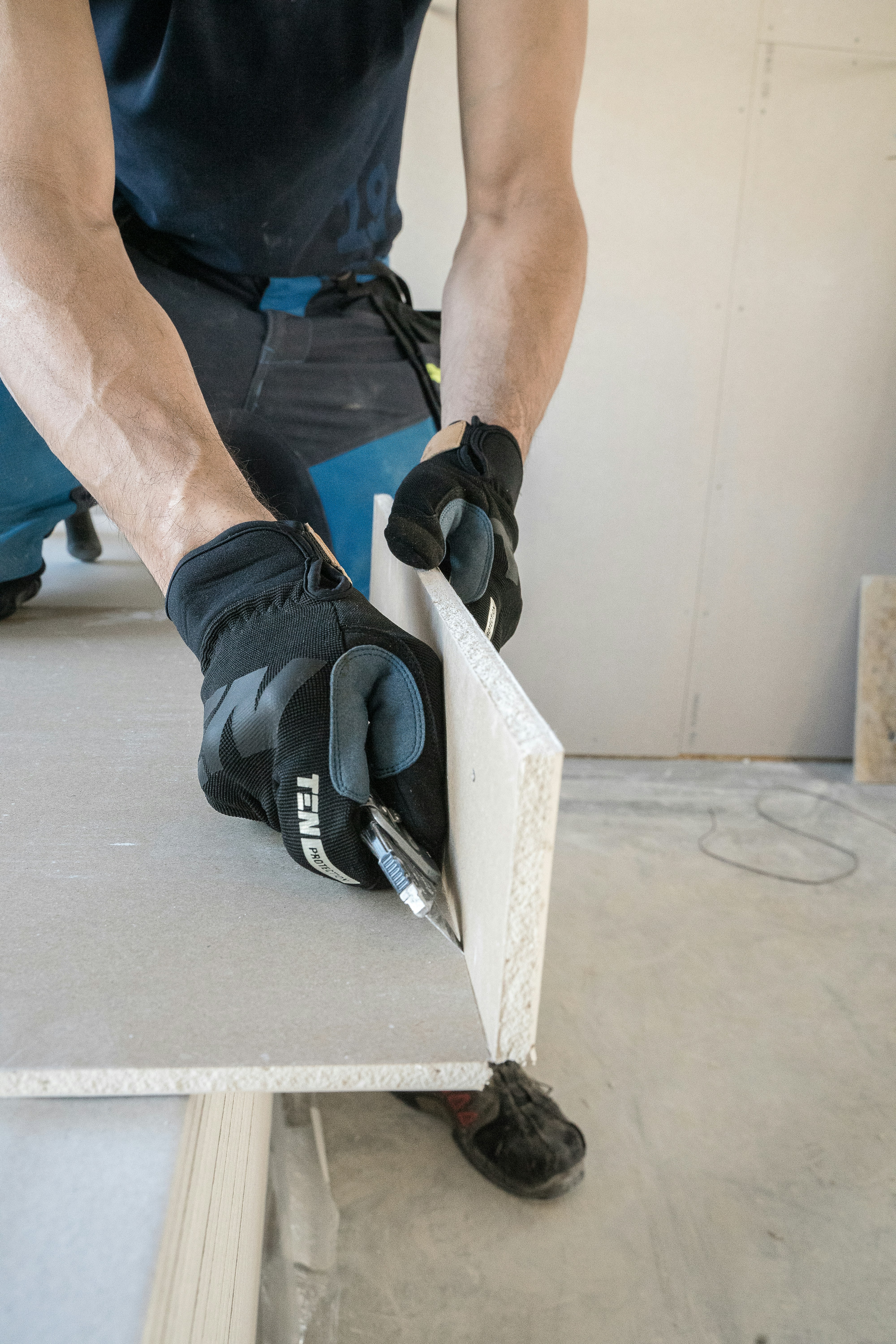 a man working on a piece of wood