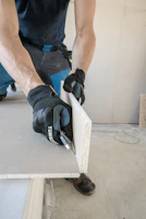 a man working on a piece of wood