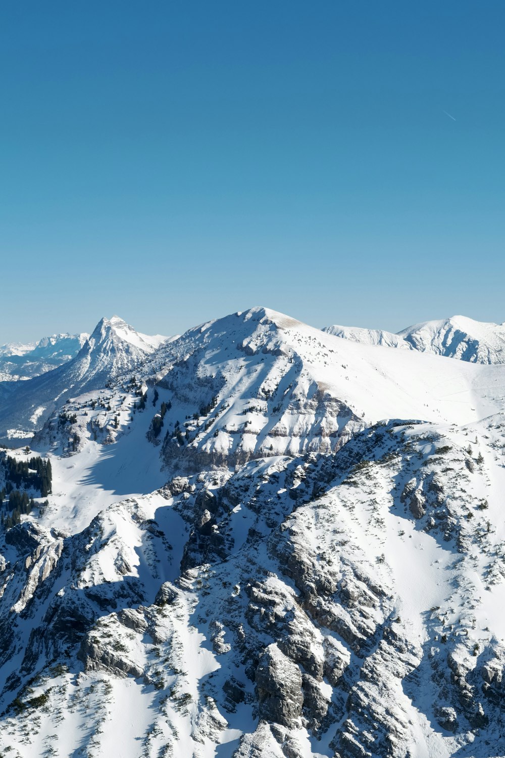 a view of a mountain range covered in snow