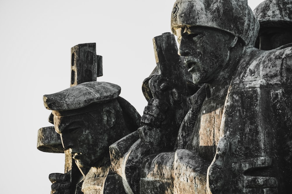 a large statue of soldiers holding a gun