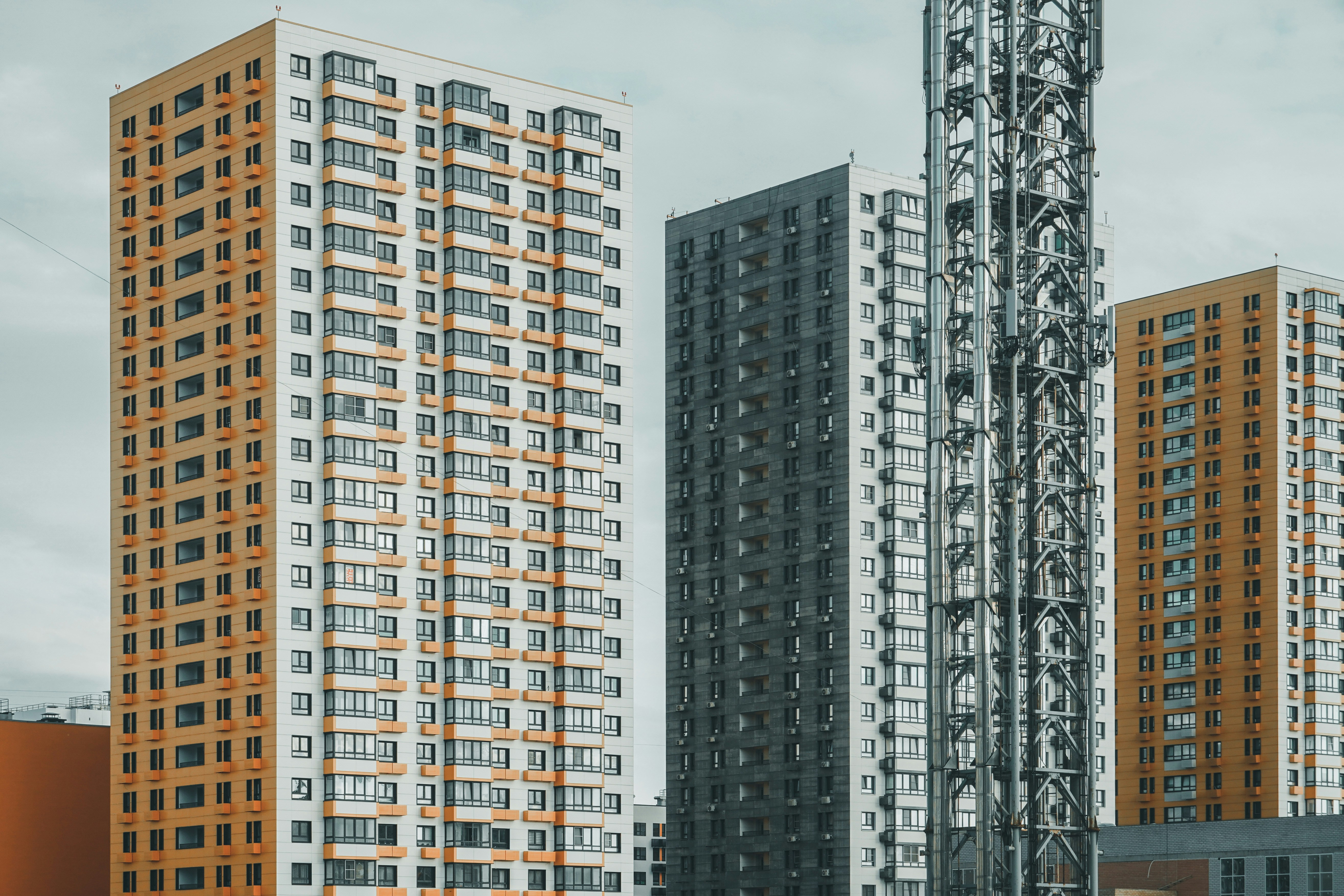 a couple of tall buildings sitting next to each other