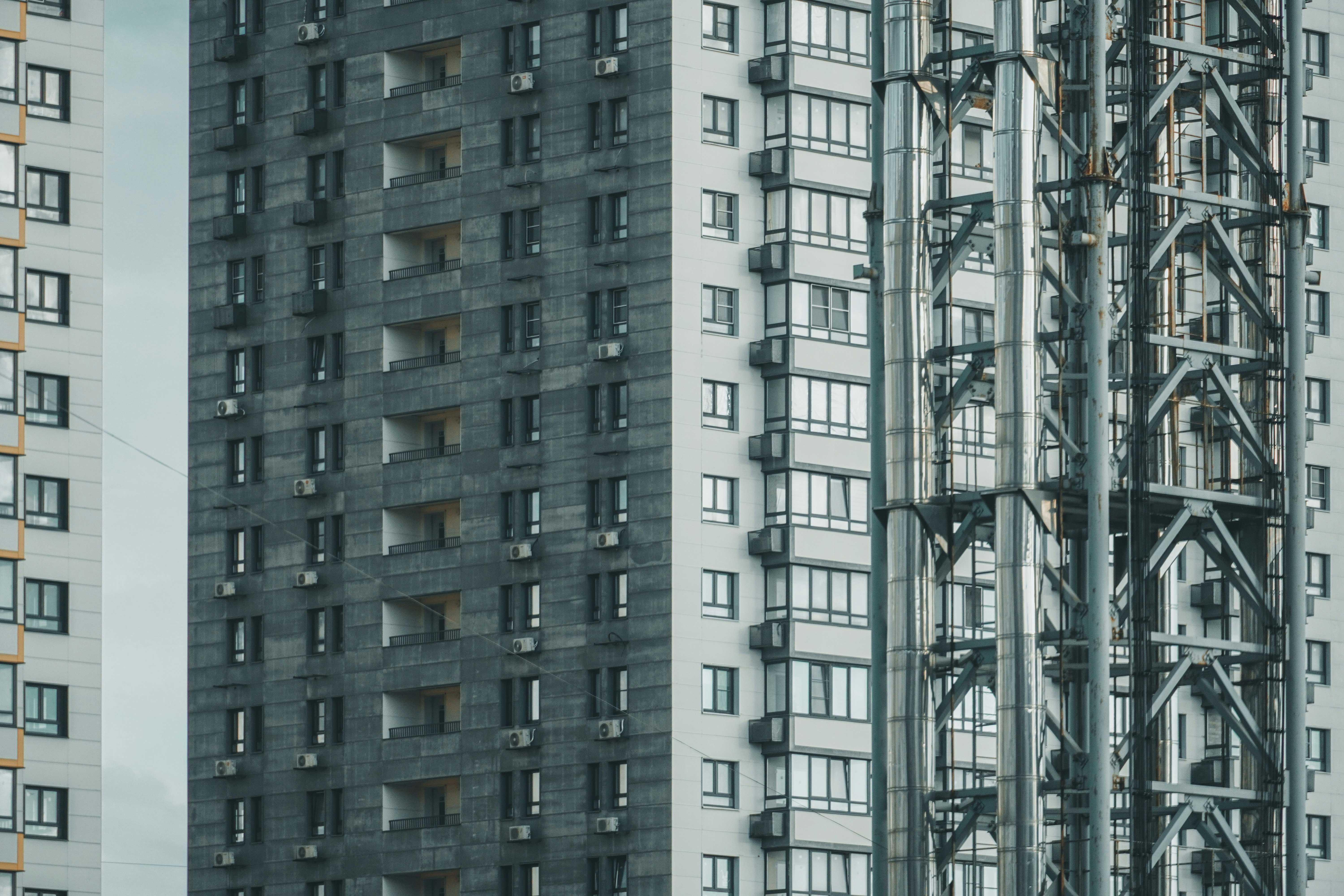 a tall building next to a very tall building
