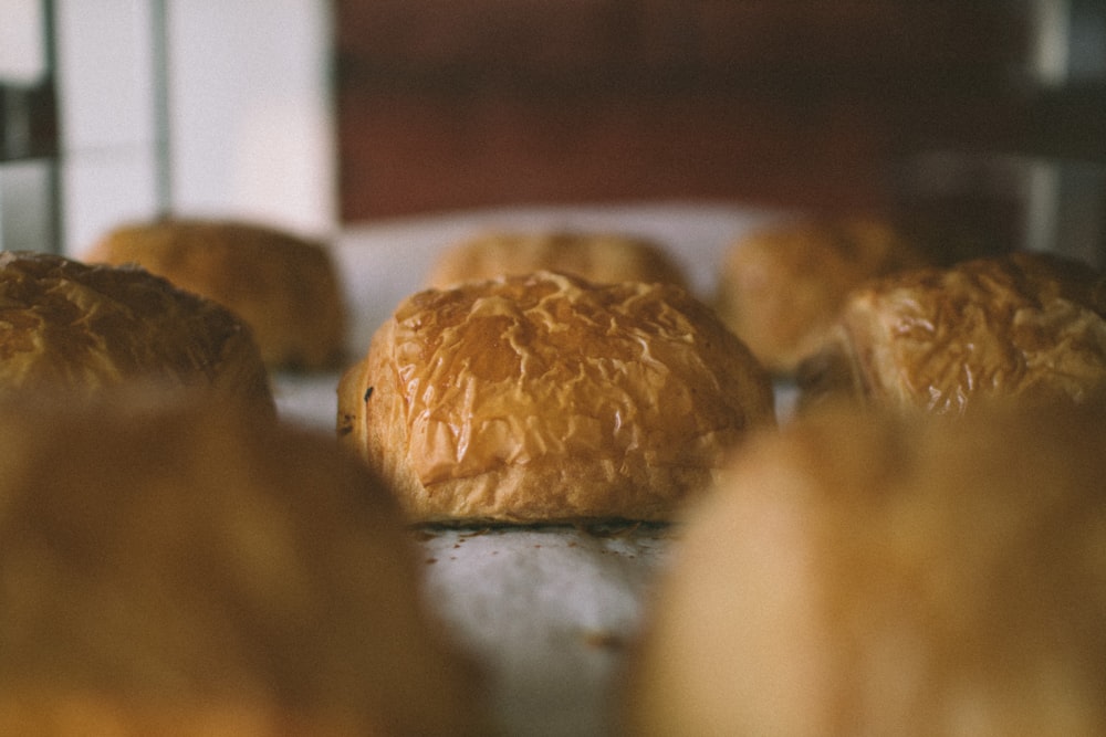 a bunch of croissants sitting on top of a counter