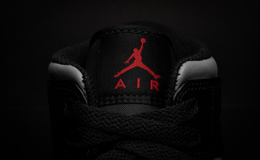 a black and red air jordan shoe