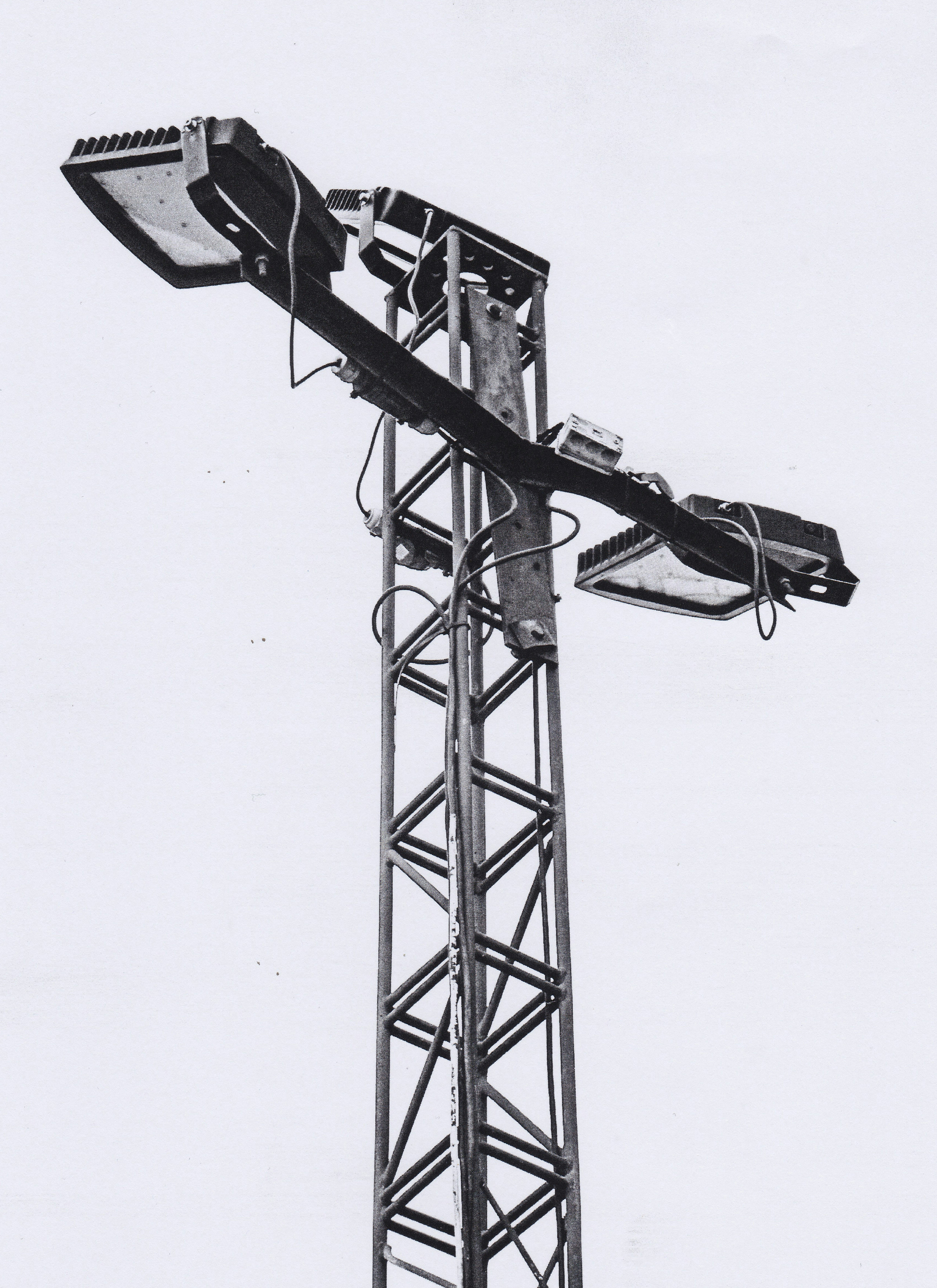 a black and white photo of a street light