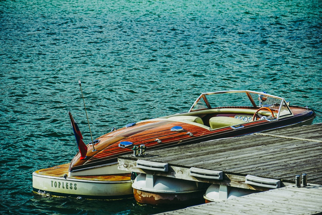 a boat is docked at a pier on the water,