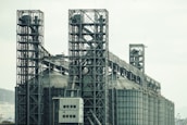 a large industrial building with a lot of pipes