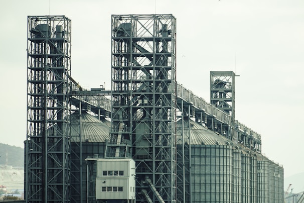 a large industrial building with a lot of pipes