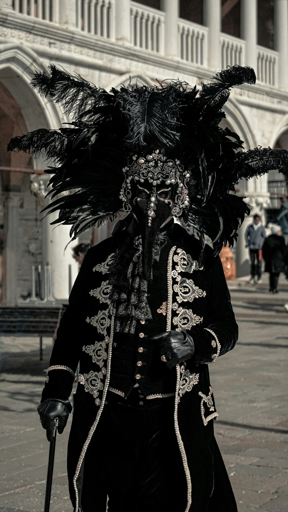 a man dressed in a black and white costume