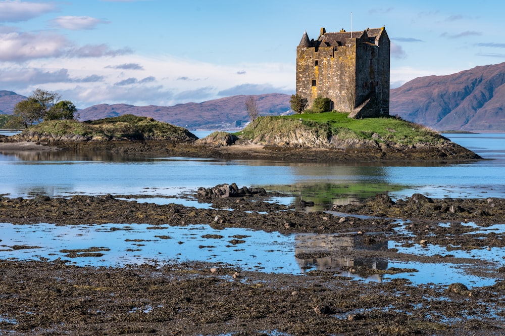 a castle sitting on top of a small island