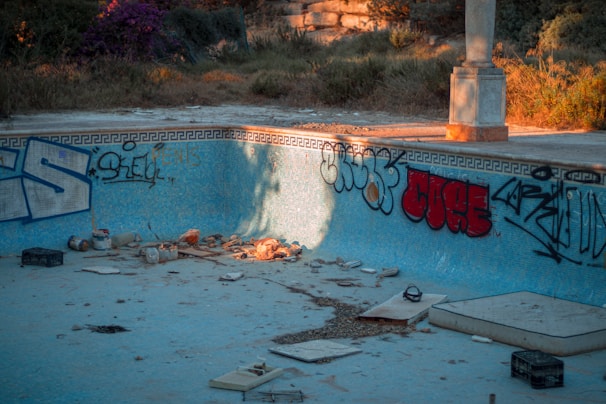 a swimming pool with graffiti on the walls