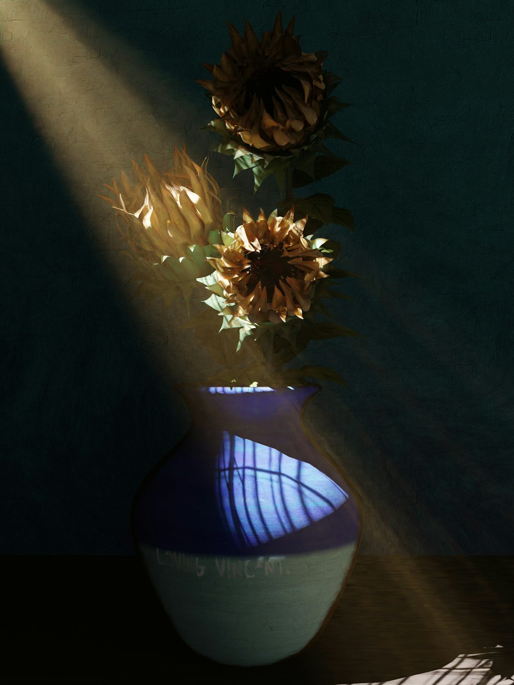 a blue and white vase with sunflowers in it