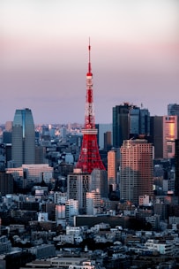 the eiffel tower in paris is lit up in red