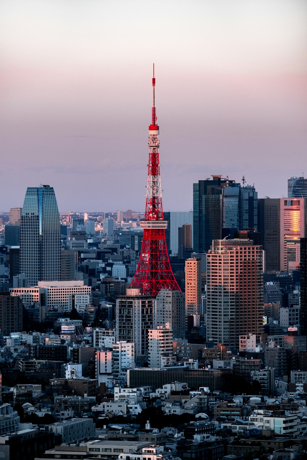 the eiffel tower in paris is lit up in red