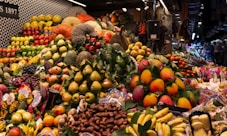 a large display of fruits and vegetables in a store