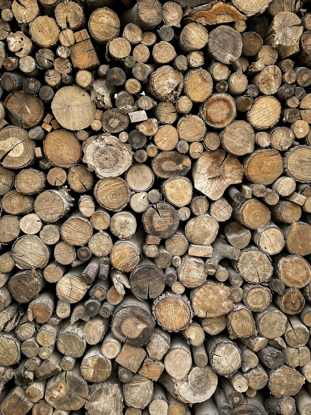 a pile of logs stacked on top of each other