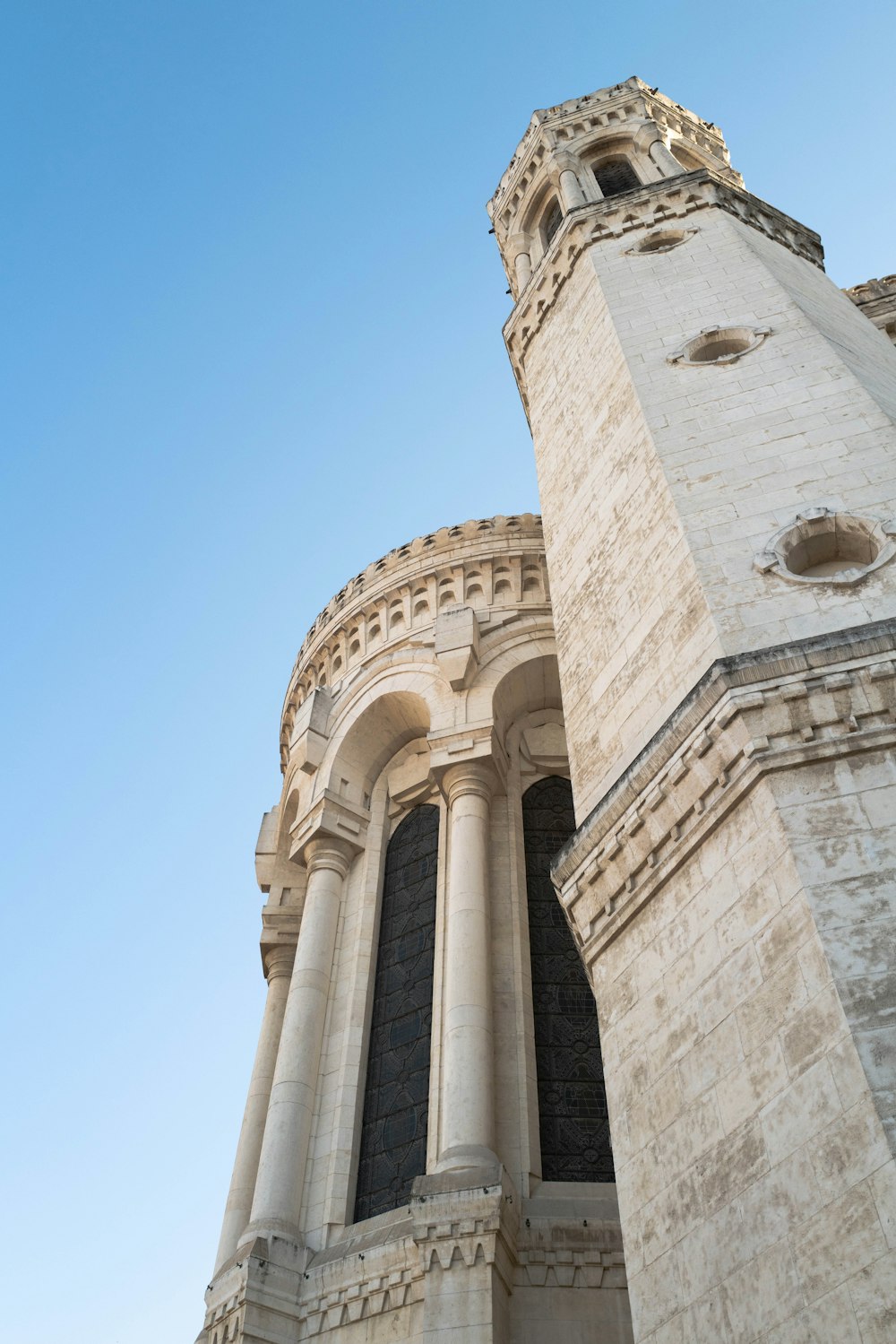 a very tall tower with a clock on it's side