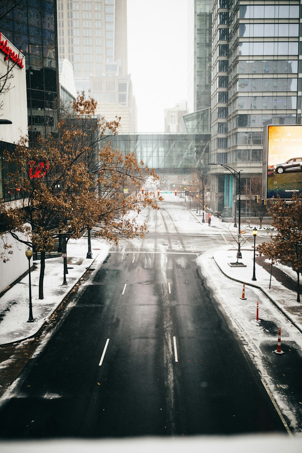 a city street with snow on the ground