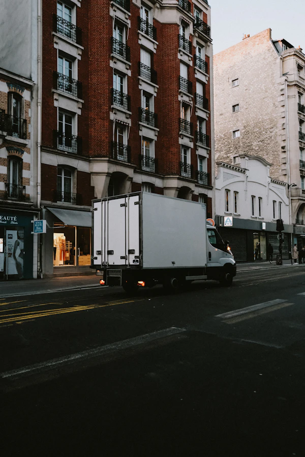 Delivery truck driving through the city for local transport