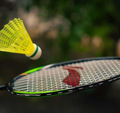 a close up of a tennis racquet with a person on it