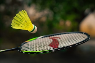 a close up of a tennis racquet with a person on it