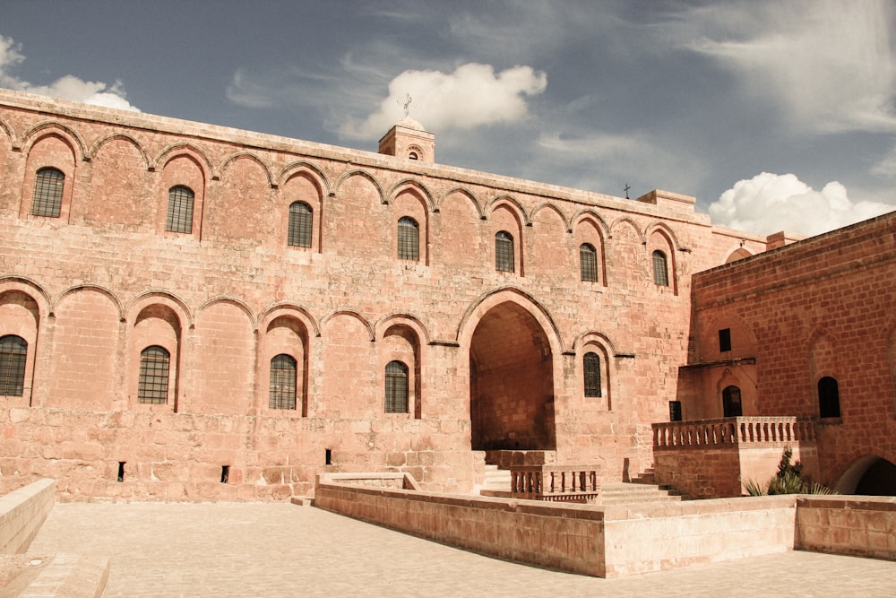 a large brick building with a clock tower on top of it