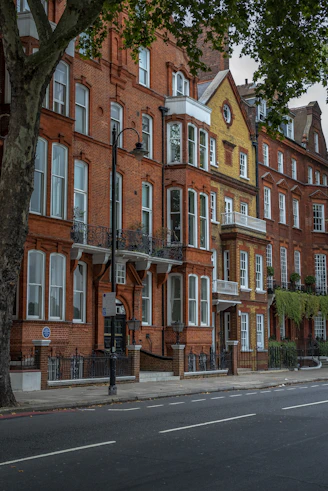 a row of red brick buildings on a city street