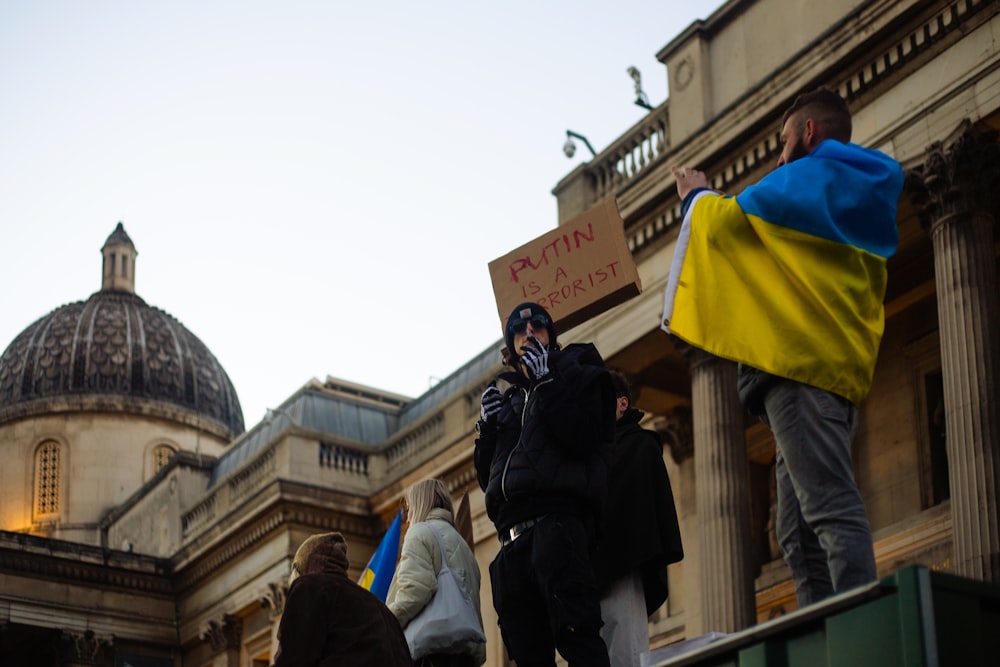 a group of people standing outside of a building