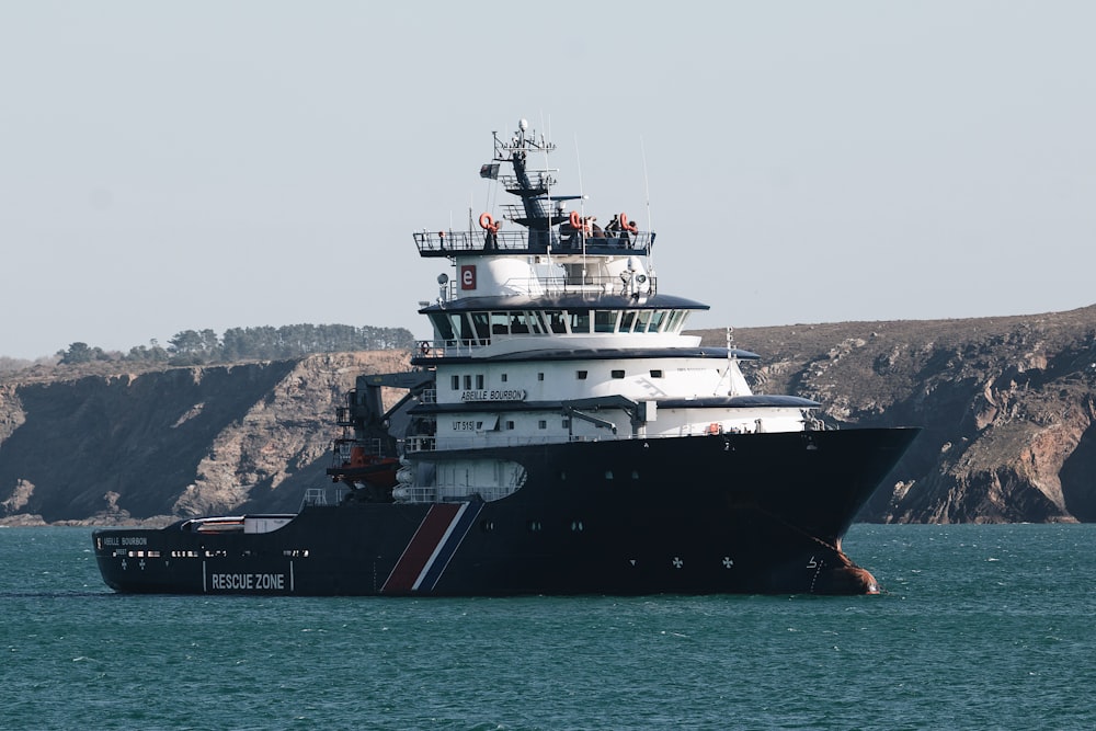 a large boat floating on top of a body of water