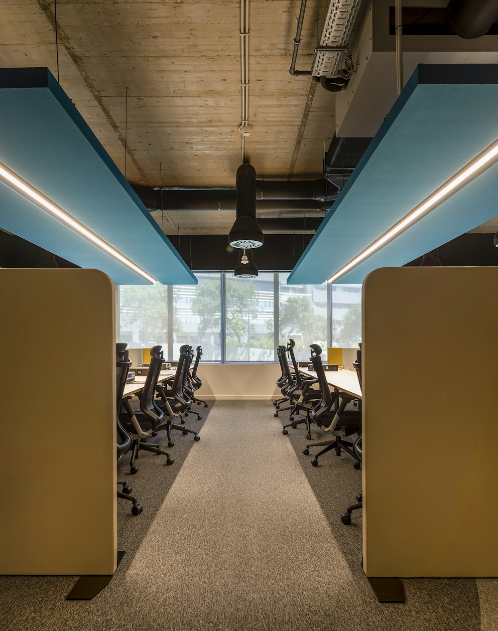 a room with a lot of desks and chairs