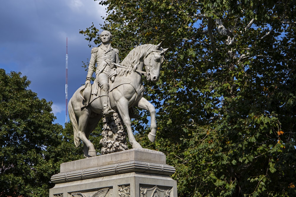 a statue of a man riding a horse