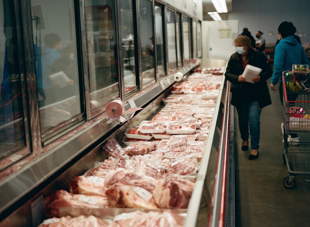 a line of meat in a grocery store