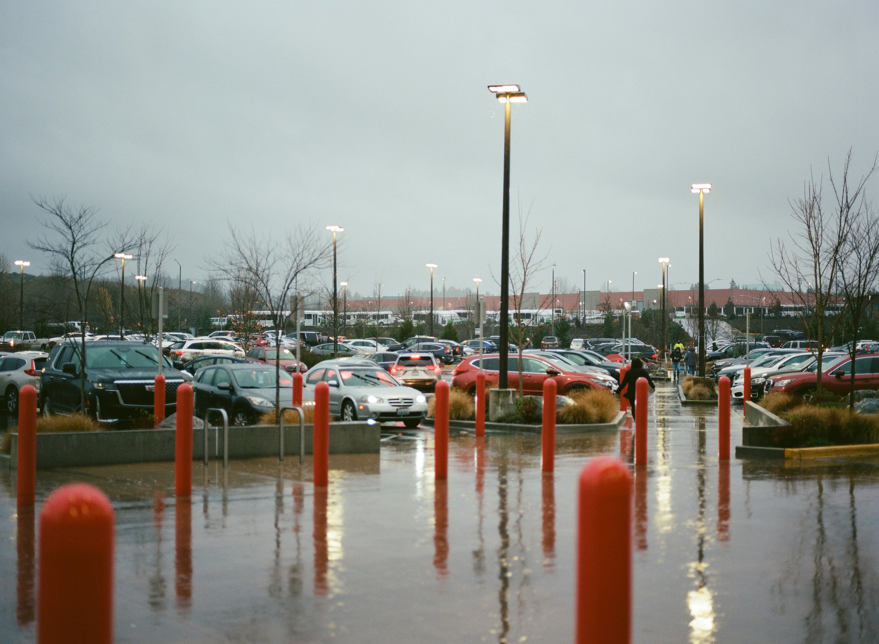 a parking lot filled with lots of parked cars