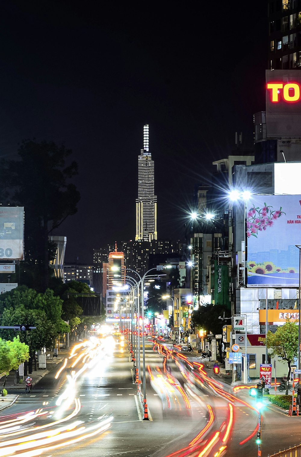 a city street at night with a lot of traffic