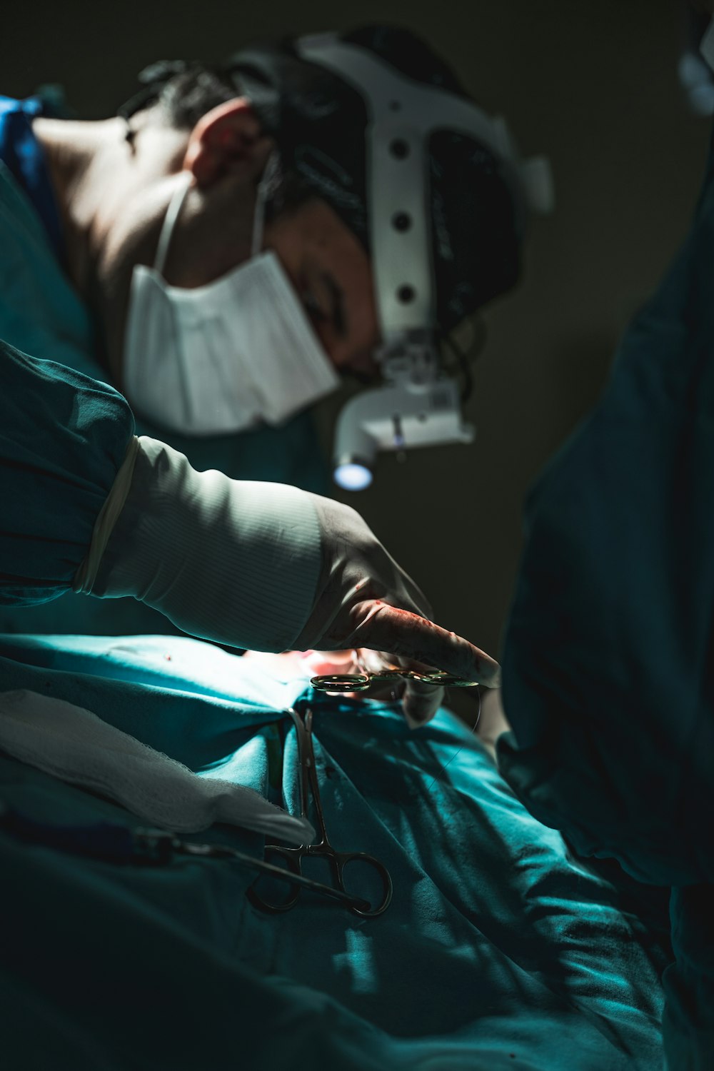 a person in a hospital bed with an iv