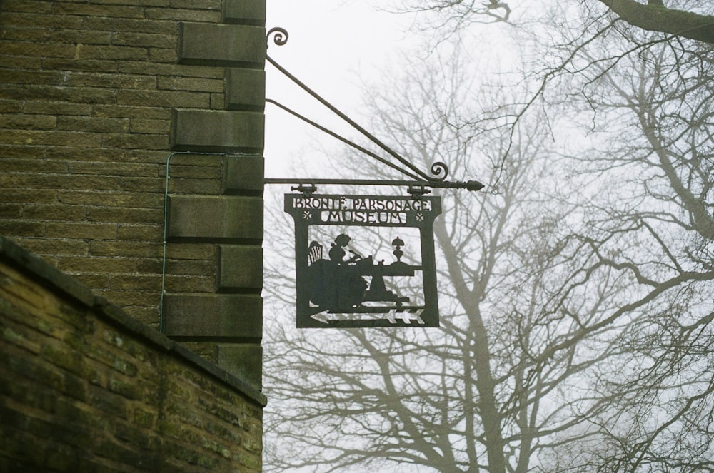 a sign on a brick building