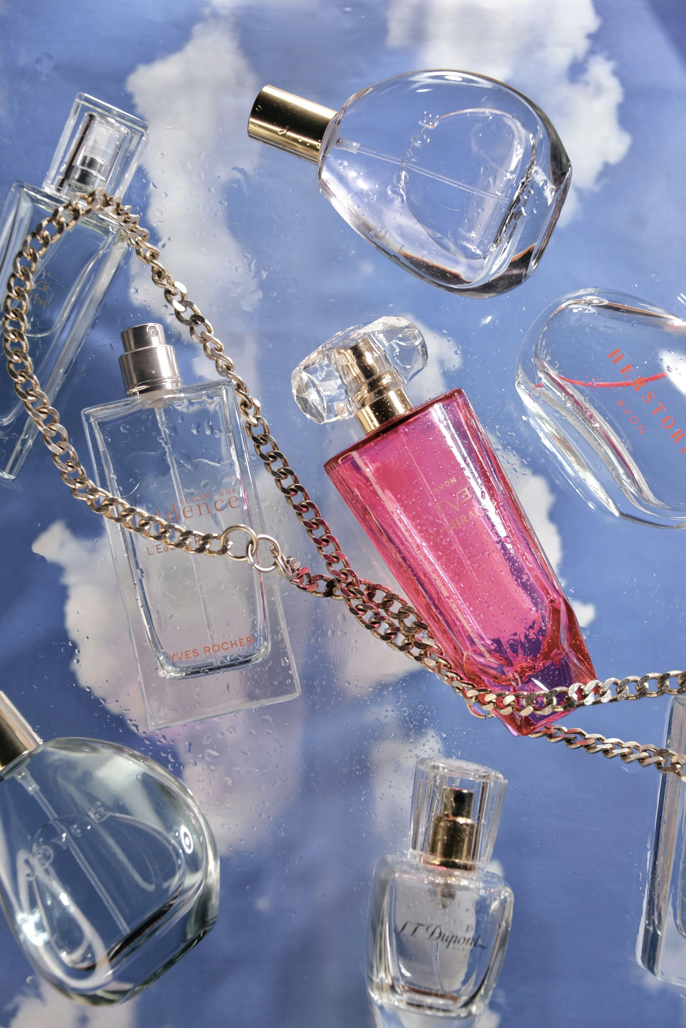 a bunch of perfume bottles on a table