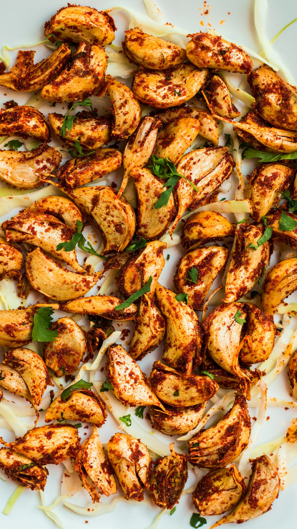 a white plate topped with grilled chicken and onions