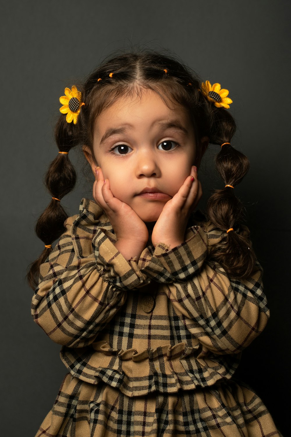 a little girl with a flower in her hair