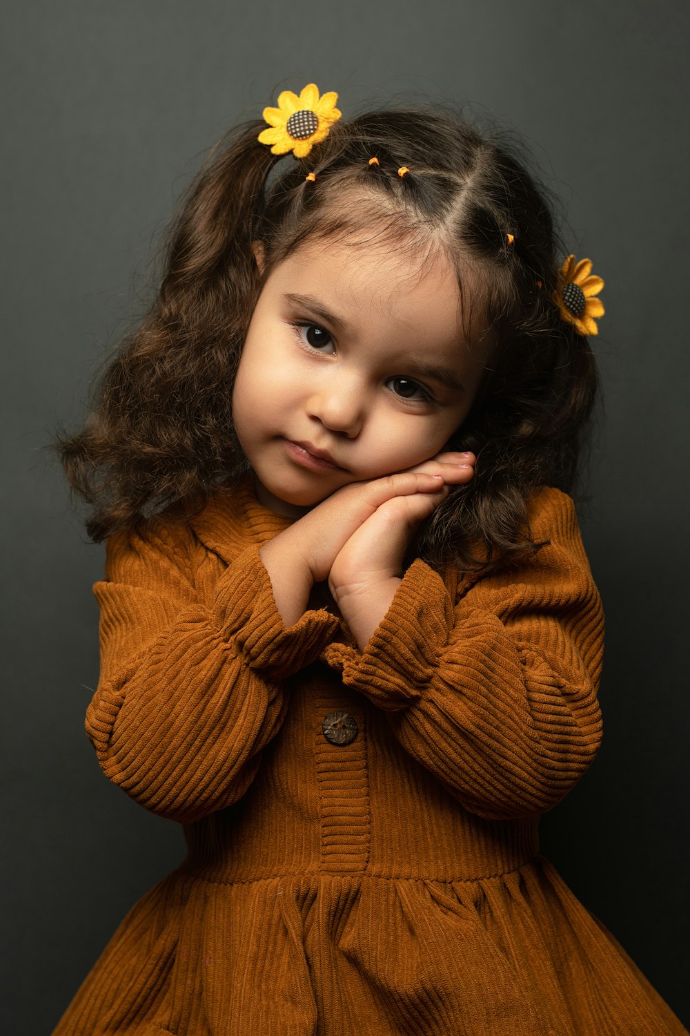 a little girl with a flower in her hair