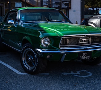 a green mustang parked in a parking lot